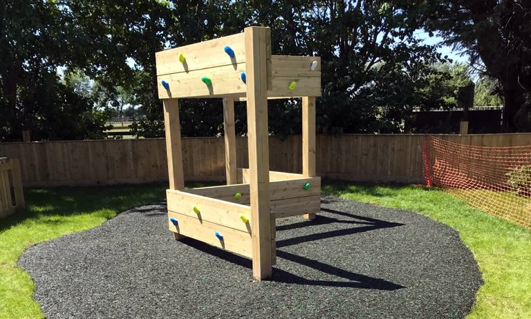 Wooden traversing wall for childrens outdoor play time