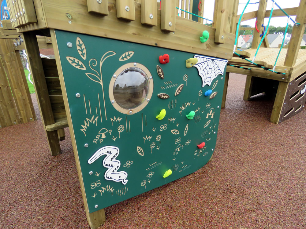 Wooden play equipment installed outdoors at a school